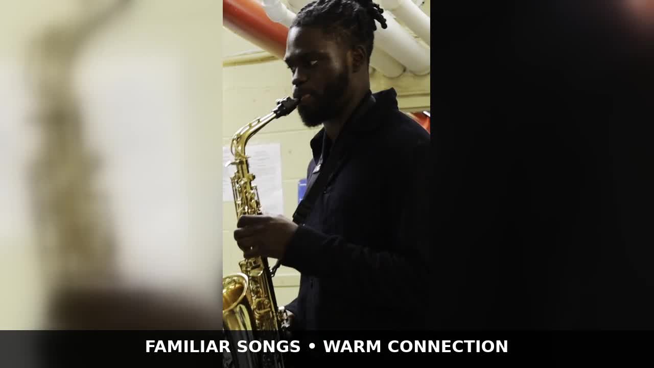 Tyler Morgan playing saxophone at a community music performance